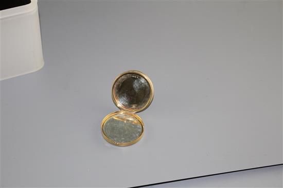 A George V engine turned 9ct gold circular compact, London, 1928, 38mm, gross 21.8 grams.